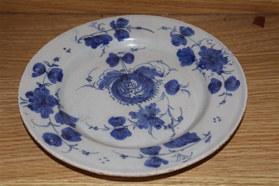 An 18th century Glasgow Delftware charger and a matching plate, largest 35.5cm